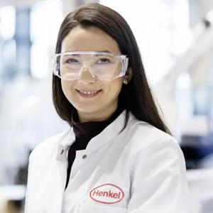 A person in protective lab wear in a laboratory setting