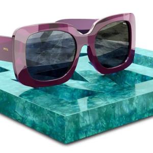 A pair of sunglasses on a quartz stone