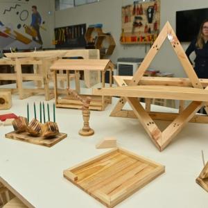 Projects displayed on a table in a workshop.