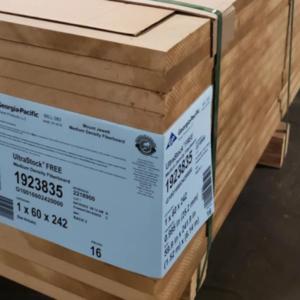 A stack of wood pieces with Georgia-Pacific label and tie-downs.