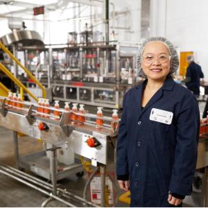 Employee stands in factory