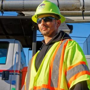 Joey Hunt in hard hat and yellow vest