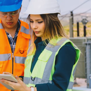 two construction workers using a tablet 