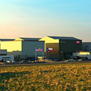 Exterior of a large building in an open area.