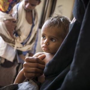A child is treated at one of Action Against Hunger's health clinics in Yemen. / Photo by Florian Seriex