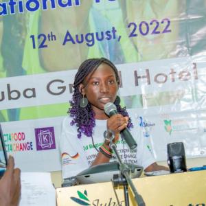 A young speaker addresses a crowd of youth volunteers. The event was hosted by Action Against Hunger in 2022 in Juba, South Sudan.