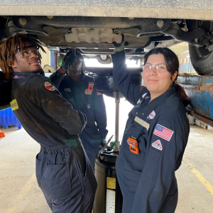 Student practicing vehicle maintenance 