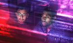 2 people looking at a computer screen