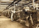 Old photo of people working in a factory