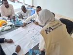 people working together on a chart