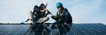 2 people installing a solar panel