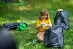 Child picking up litter