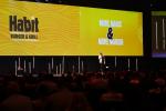 Presenter on stage at GFC