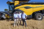 3 people in front of a tractor