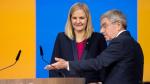 Kirsty Coventry being welcomed up to a lectern 