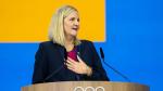 Kirsty Coventry speaking at a lectern