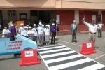 A group of people about to enter a crosswalk 