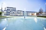 building with water feature in front