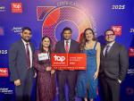 Five people holding an award