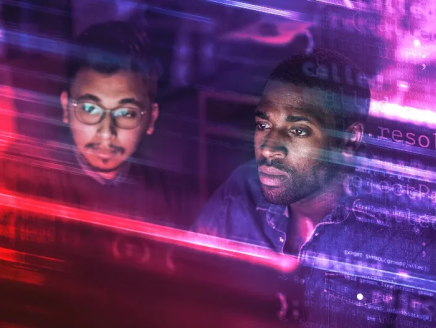 2 people looking at a computer screen