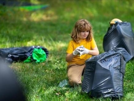 Child picking up litter