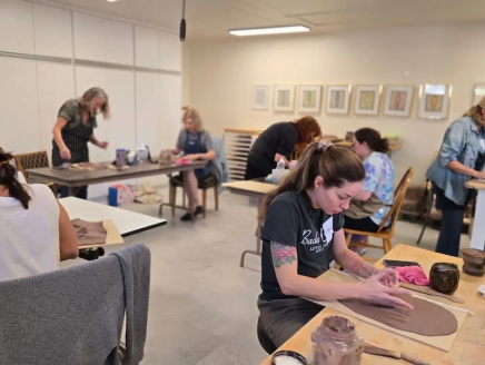 Mandy working on a pottery project.