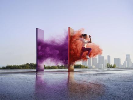 image of runner running through colors