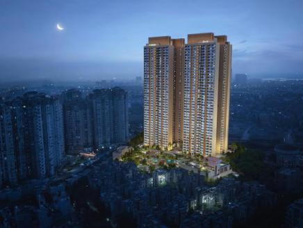 A tall, illuminated building at night