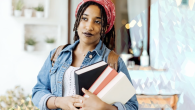 person holding books