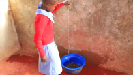 Child turning on a tap 