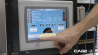 Person pointing to a touch screen