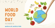 The text "World food day October 12 water is life, water is food" with an illustration of the globe on a wooden spoon, with vegetables 