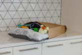 A parcel in recyclable packaging on a worktop 