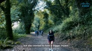 people hiking on a forest trail