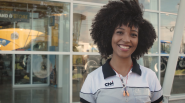 A person in CNH uniform outside a building