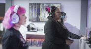 Three women shown playing video games at the JBL Quantum Changemakers Challenge. at the 