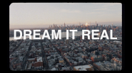 "DREAM IT REAL" over city skyline