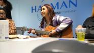 HARMAN Will: Young girl playing an acoustic guitar.