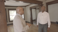 two black men in a new home