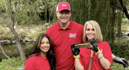 Three volunteers smiling