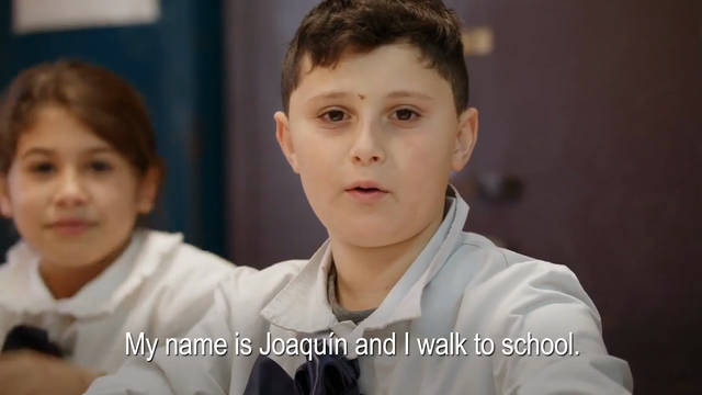 Image of child with the caption, "My name is Joaquin and I walk to school"