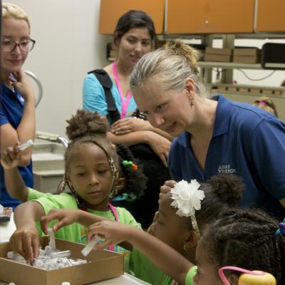 Misti Sporer, Lead Environmental Scientist for Duke Energy, leads Project Scientist campers in a hands-on STEM learning activity in a Duke Energy lab in Huntersville, N.C. Photo Credit: Deborah Young Studio.