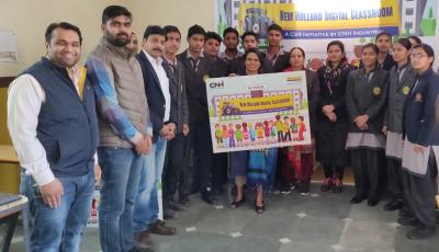 Students from a school in the town of Samalkha in the Panipat district of Haryana pose with the following representatives, from center to far left: Kavita Sah, CSR Manager India at CNH Industrial (holding sign); Saurabh Saxena, Head of Bihar & Jharkhand at New Holland Agriculture; Manish Kumar, Marketing Manager Haryana at New Holland Agriculture; and Nikhil Jain, local New Holland Agriculture Dealer