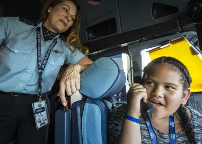Deborah Laslo, a pilot with JetBlue, left, shows Nevaeh Tafuna how to use the communication tools inside the cockpit of an A320 aircraft during Fly Like a Girl at the Salt Lake City International Airport on Friday, Sept. 7, 2018. About 80 girls attended the event, which was aimed at introducing them to aviation and STEM careers. It was hosted by JetBlue in partnership with the Utah STEM Action Center and Atlantic Aviation. Photo: Qiling Wang, Deseret News