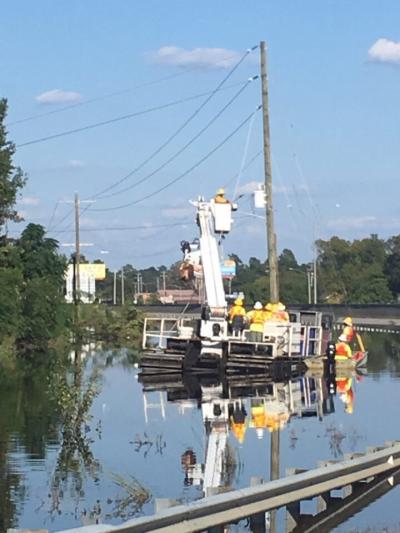 Flooding and road closures created challenges. This crew is using a track vehicle to make repairs at Caton Road and I-95 in Lumberton, N.C.