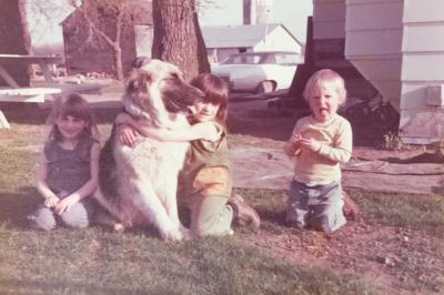 Ramona (center, hugging her dog, Muffin) and her sisters, Denise and Janet, on the farm.