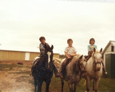 Ramona (right) riding horses with her friends Tom and Chris.