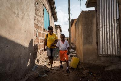 Due to his Sickle Cell Disease, Joel has lost his speech. He also struggles to walk to school, so his mom walks him there each day.