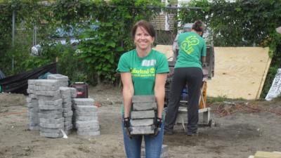 Employees of Timberland’s global headquarters served at various projects in Manchester, New Hampshire for the company’s 20th annual Serv-a-Palooza event. A team of volunteers placed over 1,000 stone pavers to lay the foundation for a new community garden at Families in Transition. Families in Transition works to provide safe, affordable housing and social services to individuals and families who are homeless or at risk of becoming homeless, enabling them to gain self-sufficiency and respect.