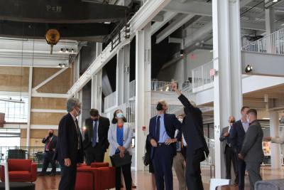 From left: Alliant Energy Senior Vice President David de Leon, Wisconsin Public Service Commission Chairperson Rebecca Valcq and Wisconsin Governor Tony Evers listen to Beloit College President Scott Bierman describe aspects of the Powerhouse redevelopment project during a tour on Wednesday in Beloit.